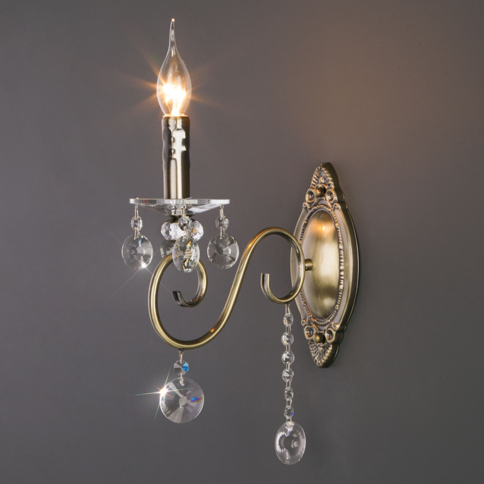 Классическое бра с хрусталем 10104/1 античная бронза/прозрачный хрусталь Strotskis фото 1 — Multielectrika